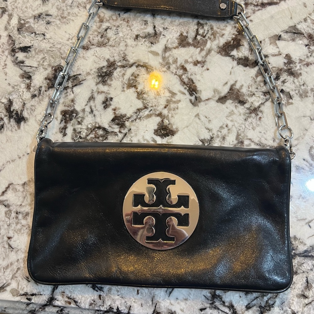Tory Burch black leather flap clutch with silver hardware. very good condition